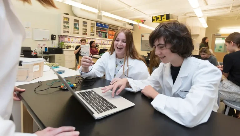 Children studying science with lab coats