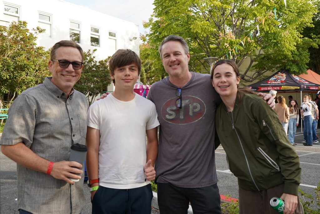 two dads with their kids