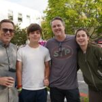 two dads with their kids